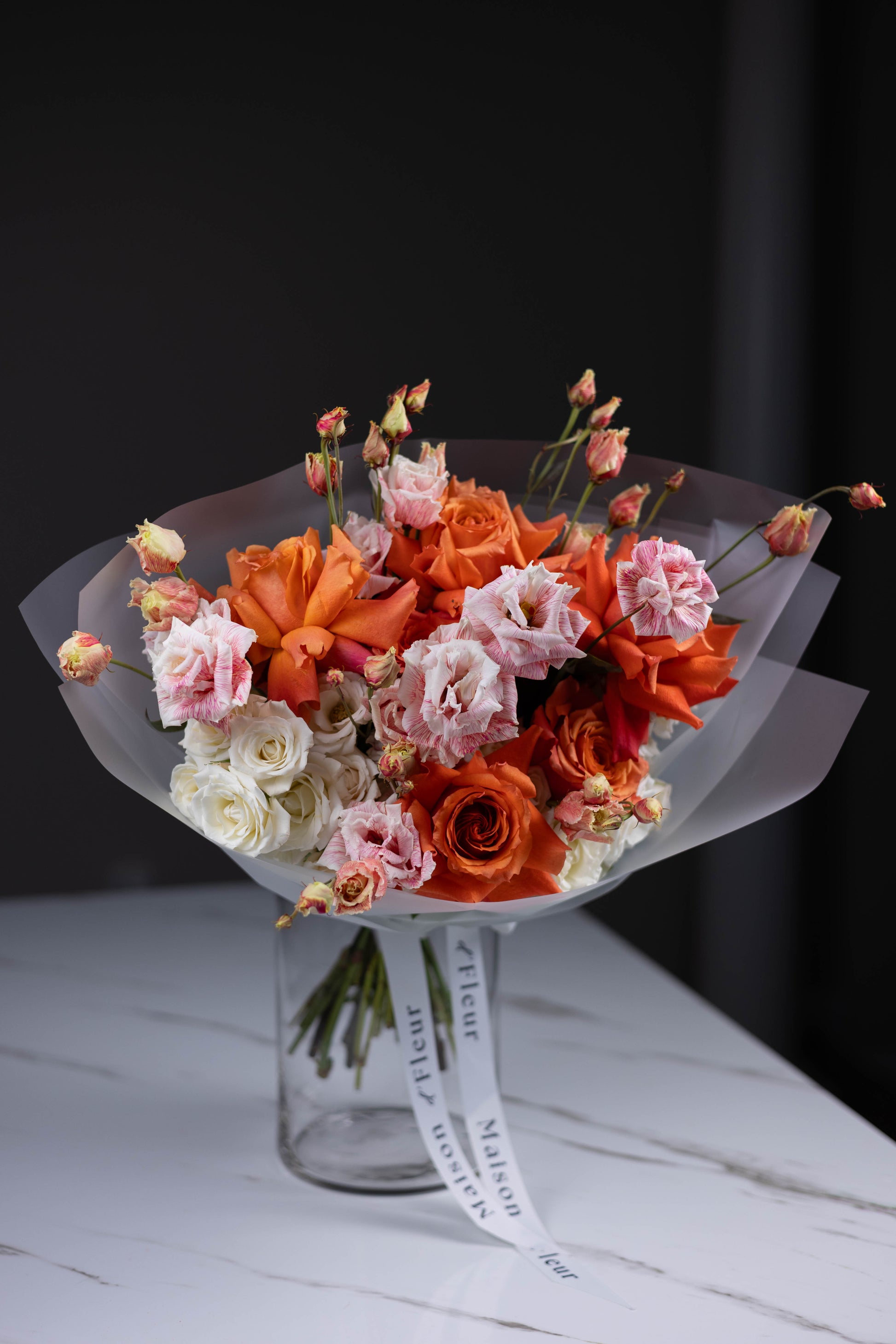 Maison d’Fleur sunset-inspired floral gift in frosted wrap