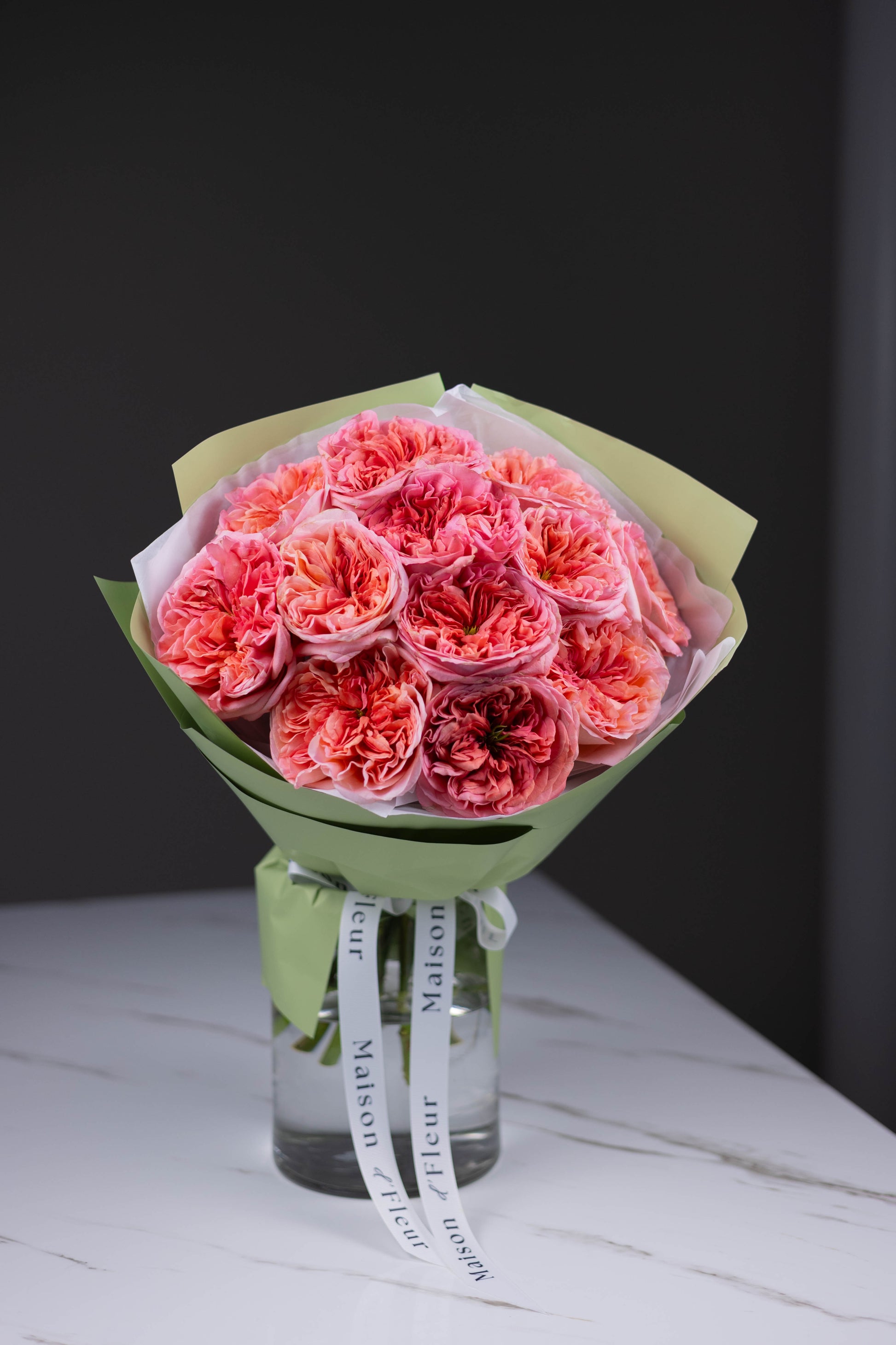 Premium pink garden roses arranged in elegant hand-tied bouquet