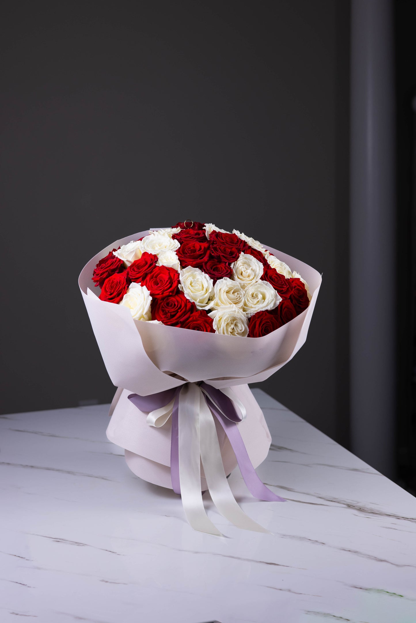 Angled photo of the bouquet placed on a marble table