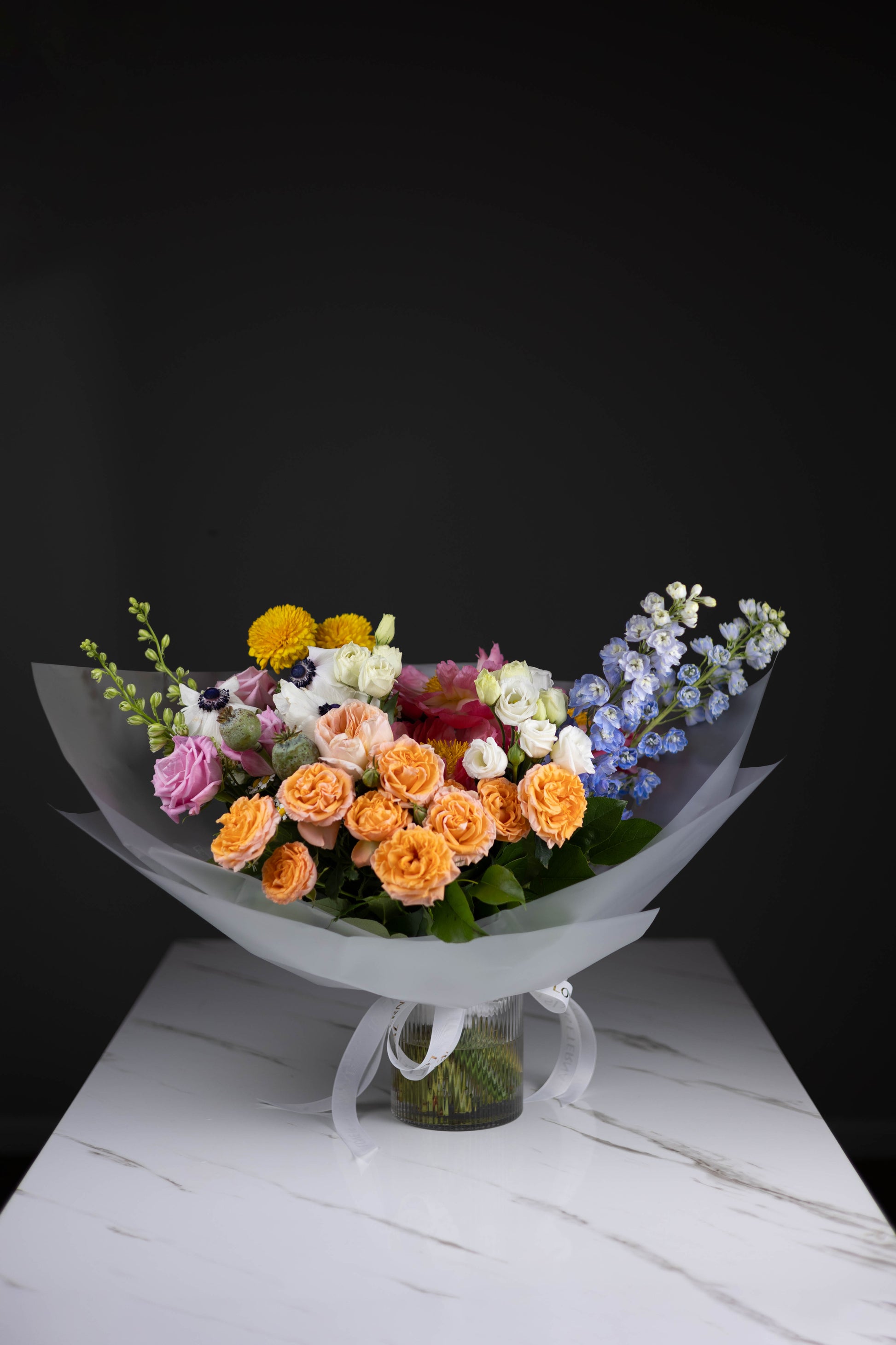 Wide shot of bouquet showcasing all flower types from left angle