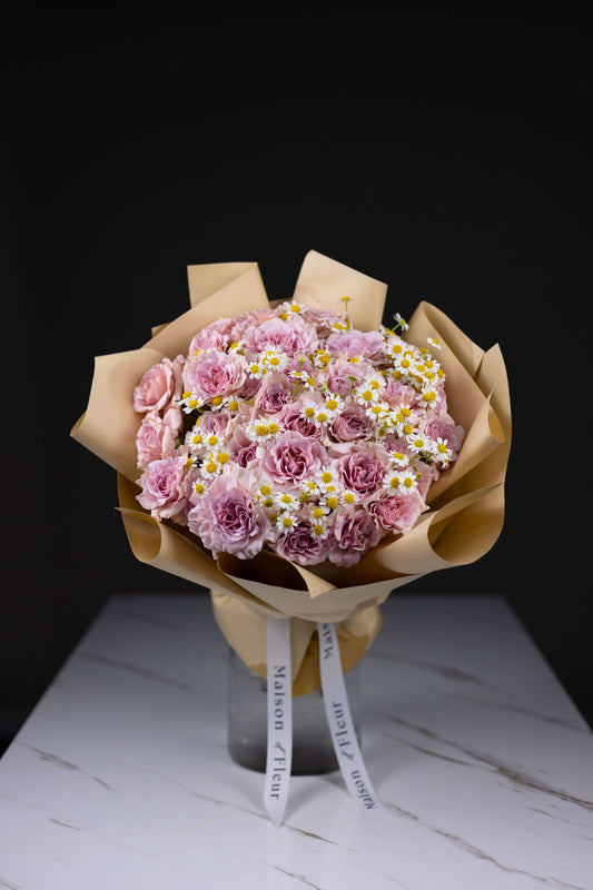 Blush pink rose bouquet with chamomile daisies in kraft paper wrap – Maison d’Fleur Charlotte NC
