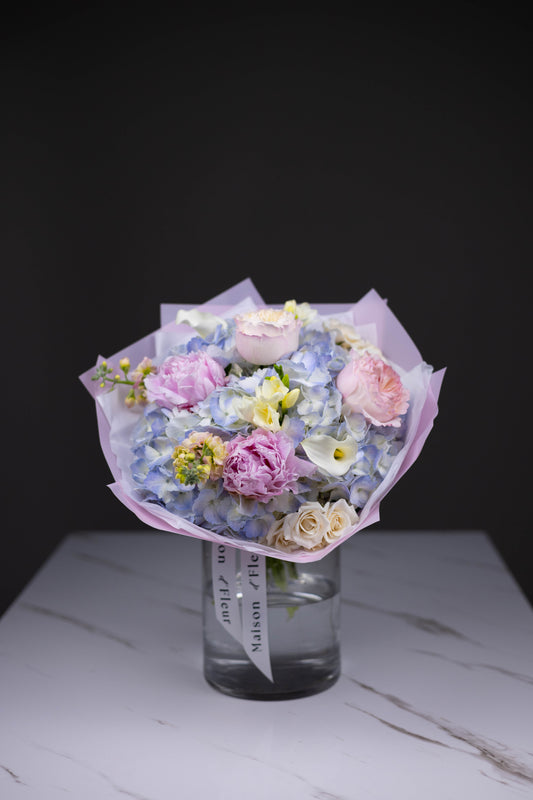 Luxury bouquet of pastel garden roses, peonies, blue hydrangeas, calla lilies, and freesias by Maison d’Fleur Charlotte NC