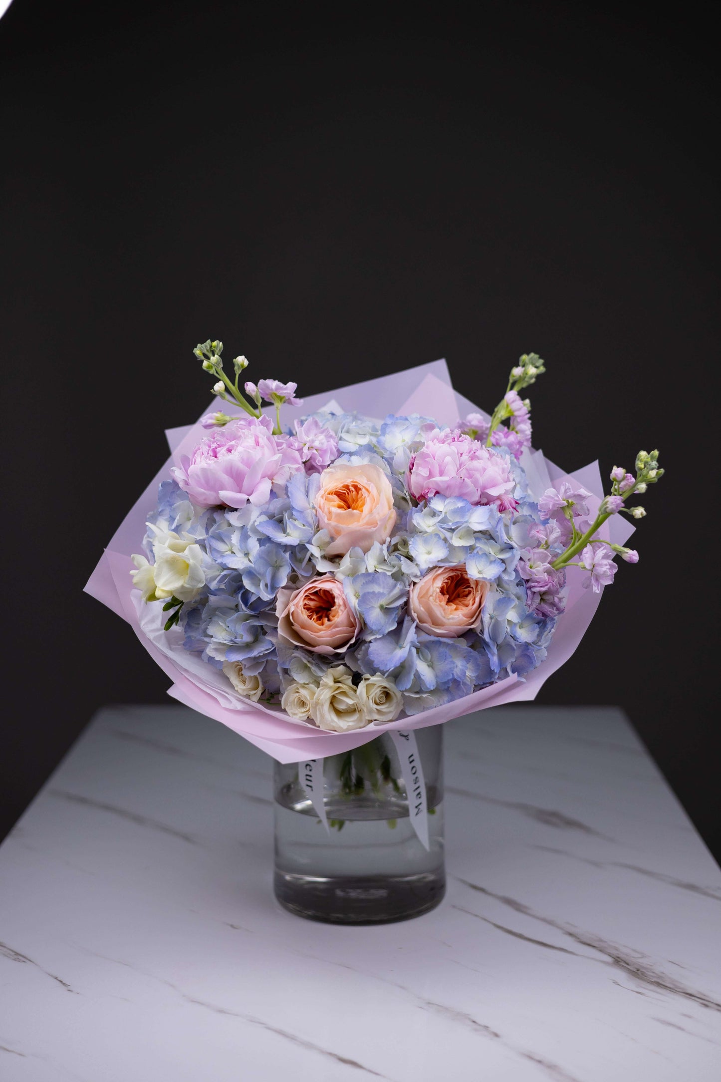 Luxury flower bouquet with Juliet garden roses, blue hydrangeas, and pink peonies by Maison d’Fleur Charlotte NC