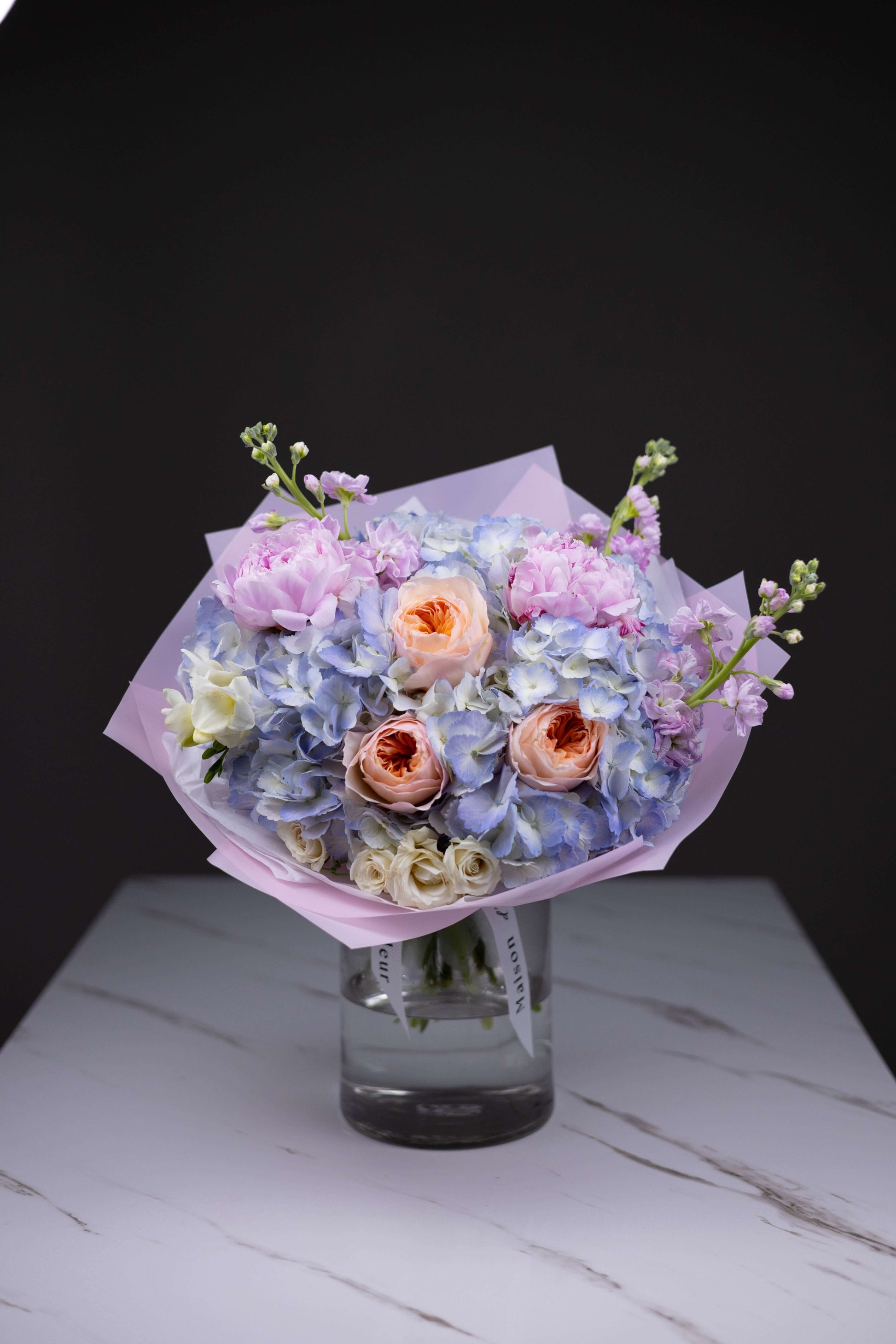 Luxury flower bouquet with Juliet garden roses, blue hydrangeas, and pink peonies by Maison d’Fleur Charlotte NC