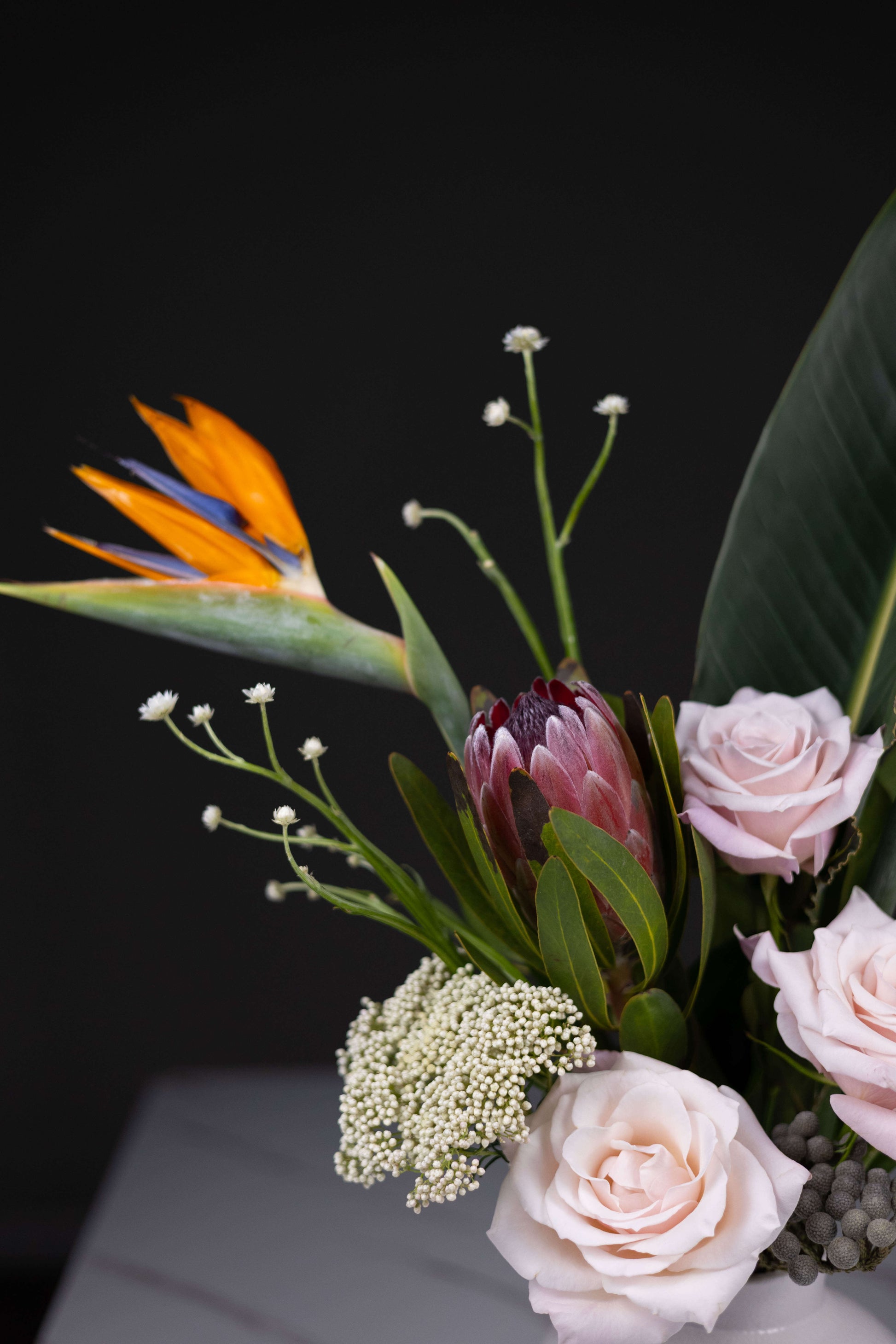 Exotic flower bouquet with Bird of Paradise and pink protea by Maison d’Fleur